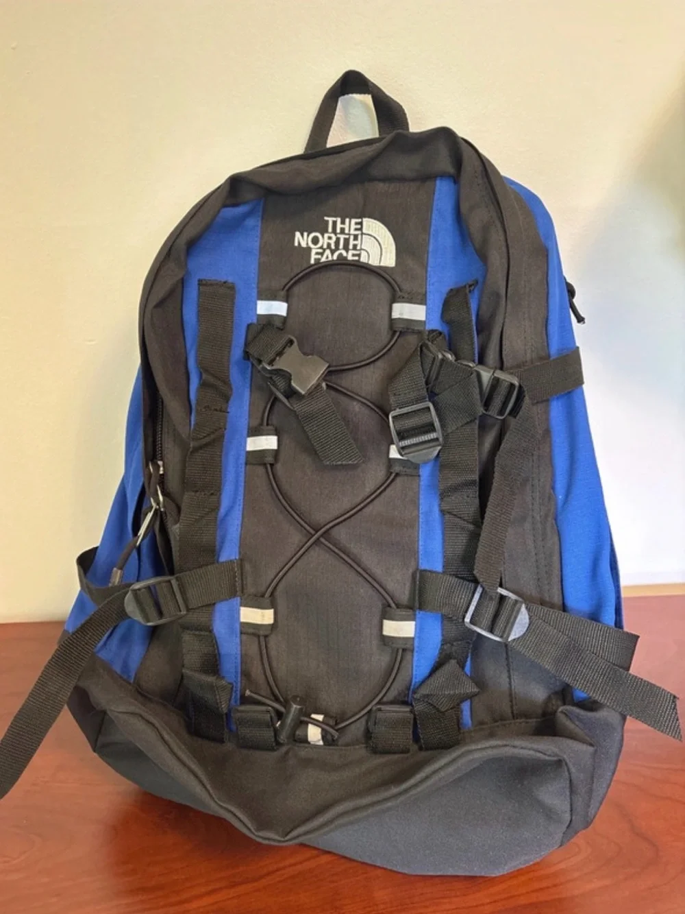 The North Face Black and Blue Men's Backpack with Utility Straps